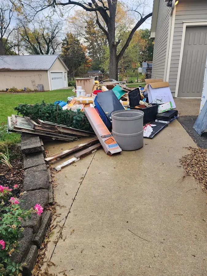Dumpster being loaded with debris for Residential Dumpster Rental in Athens
